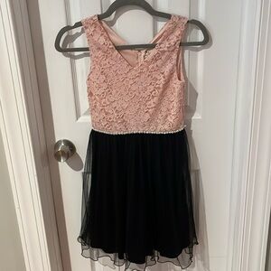 Fancy dress with a pink sparkly top and a black mesh skirt